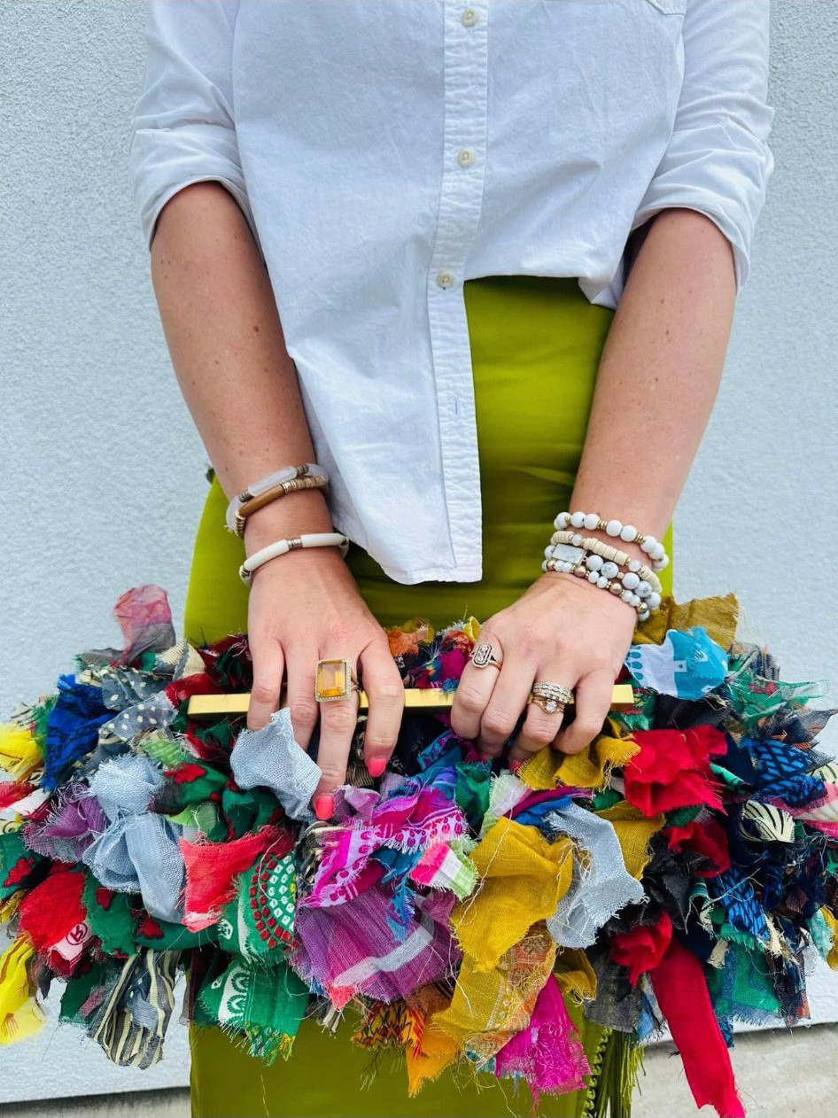 Colorful fabric clutch — hands close-up