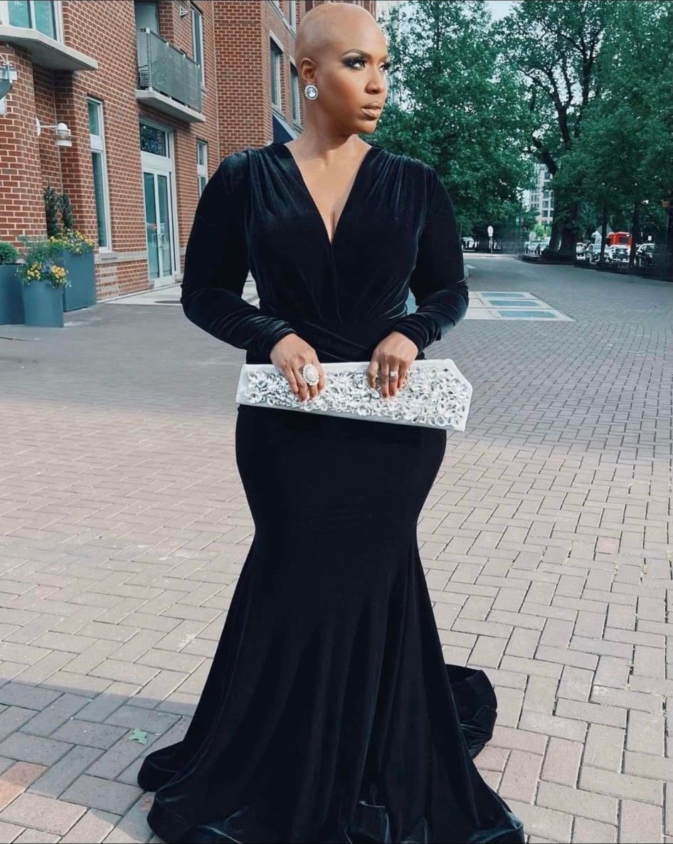 Black velvet mermaid gown, crystal clutch