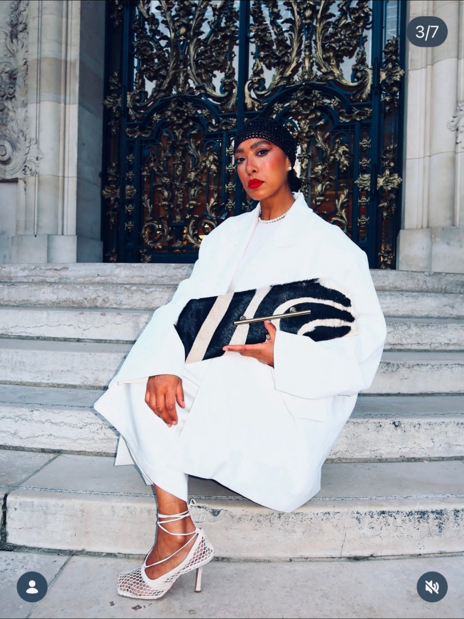 Paris — seated on steps with clutch