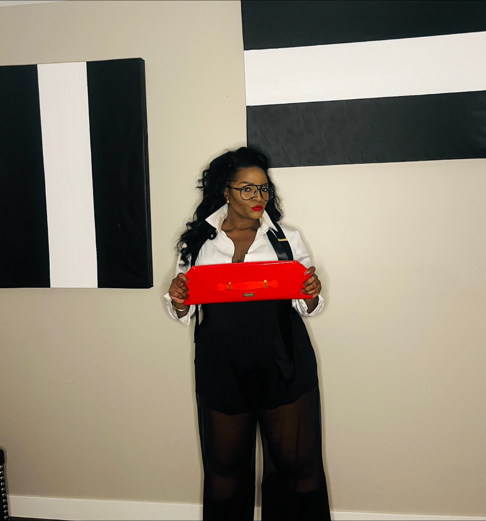 White shirt — red clutch, B&W geometric art
